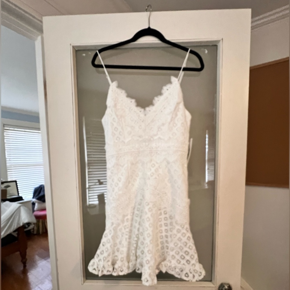 New. Cute white eyelit mini dress. US size M (aus 10).